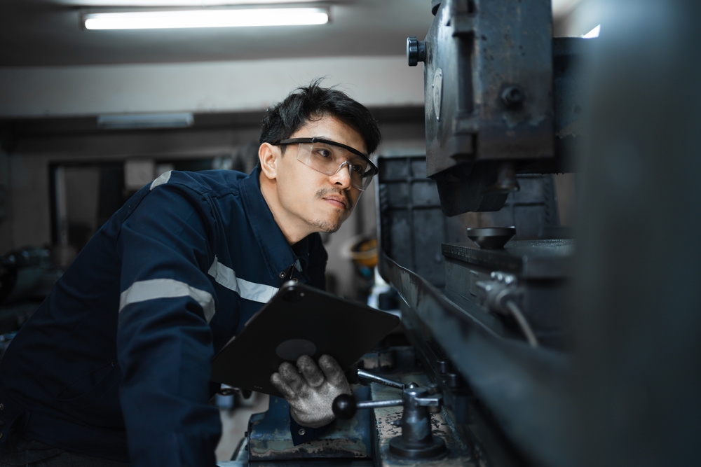 Worker using digital forms on tablet